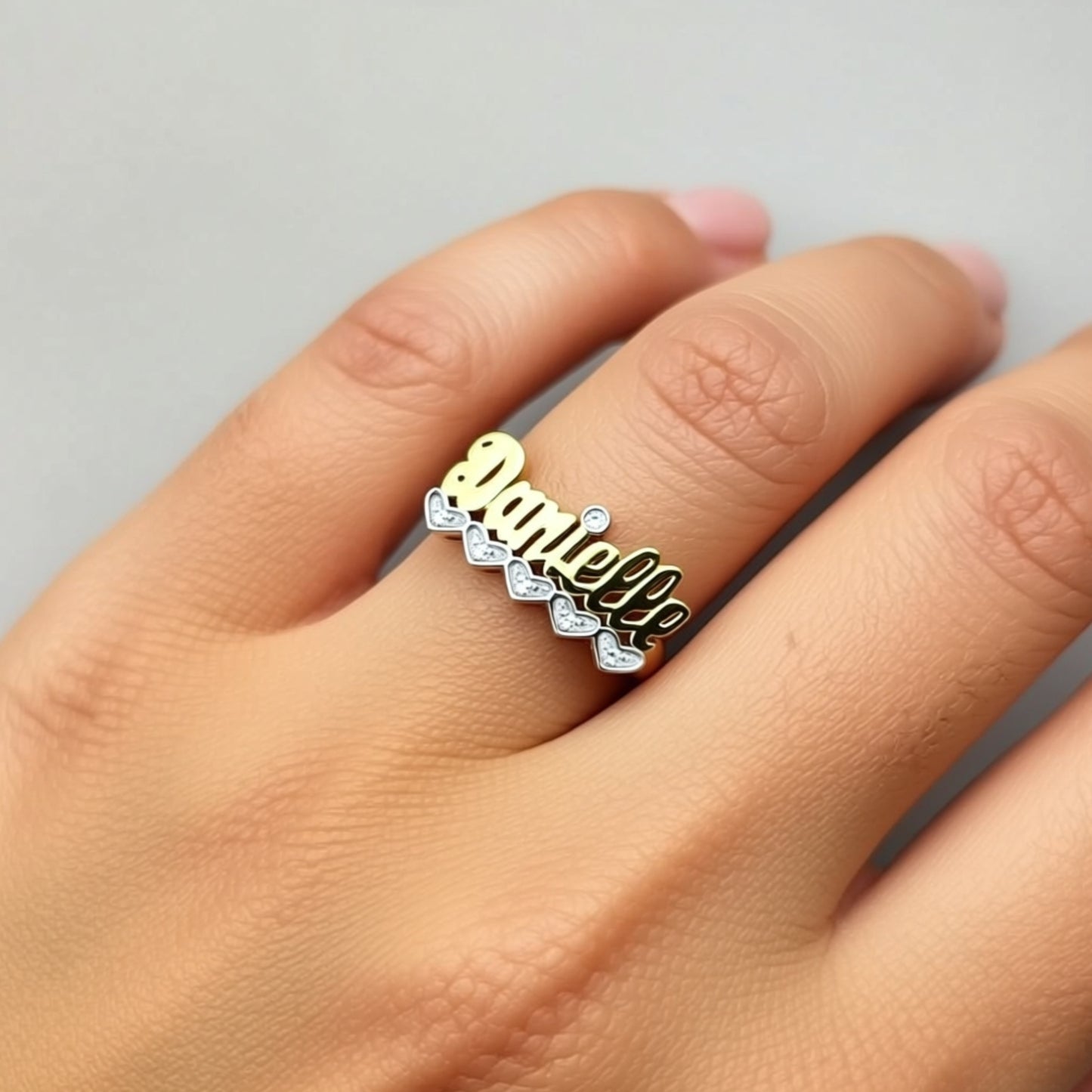 gold-name-ring-with-diamonds-R134 on a hand