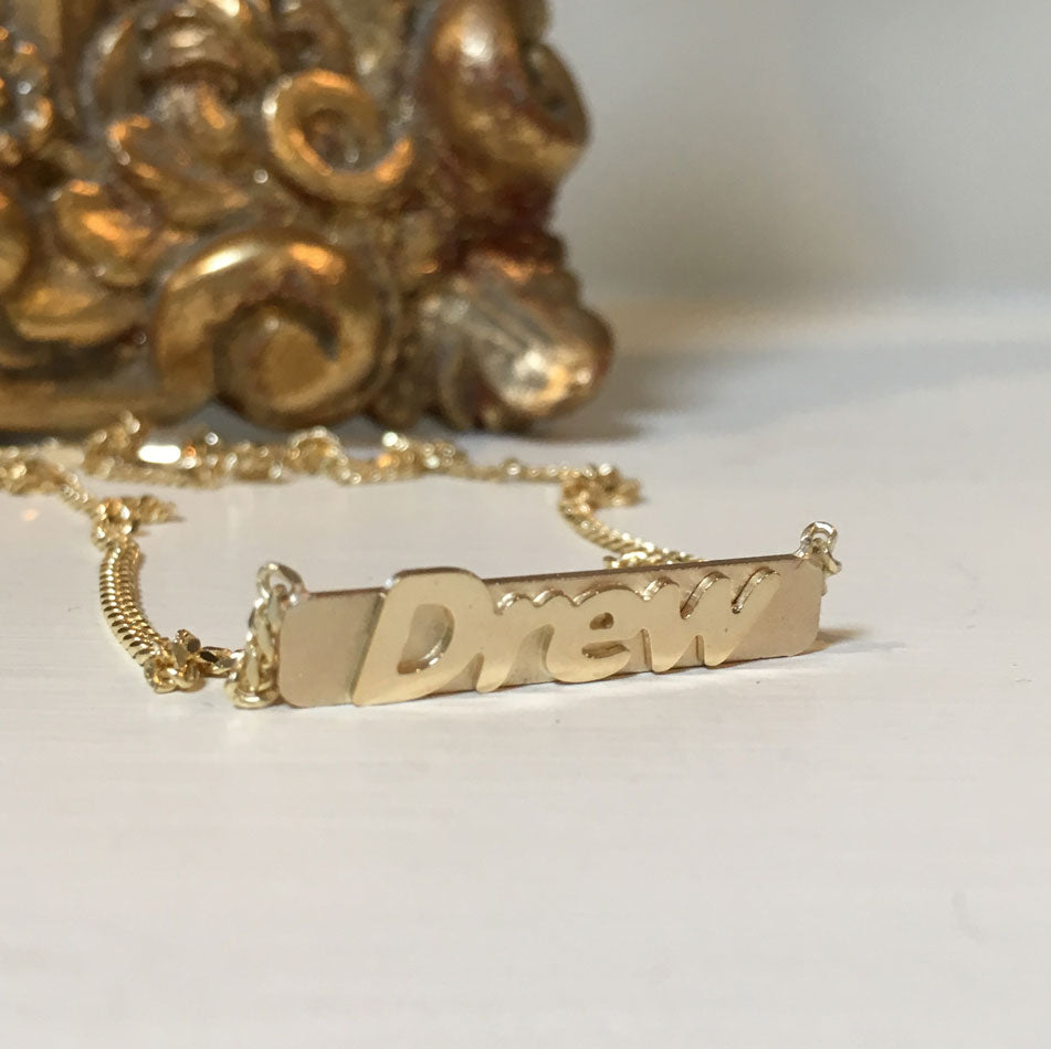 14K gold raised letter bar necklace