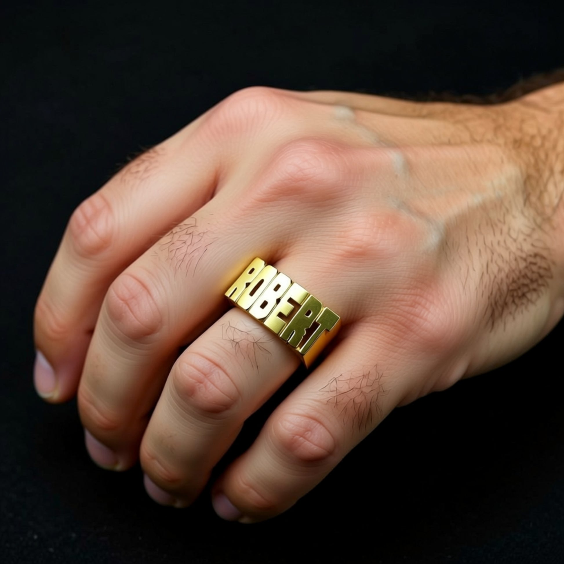 Large Block Gold Name Ring on a hand