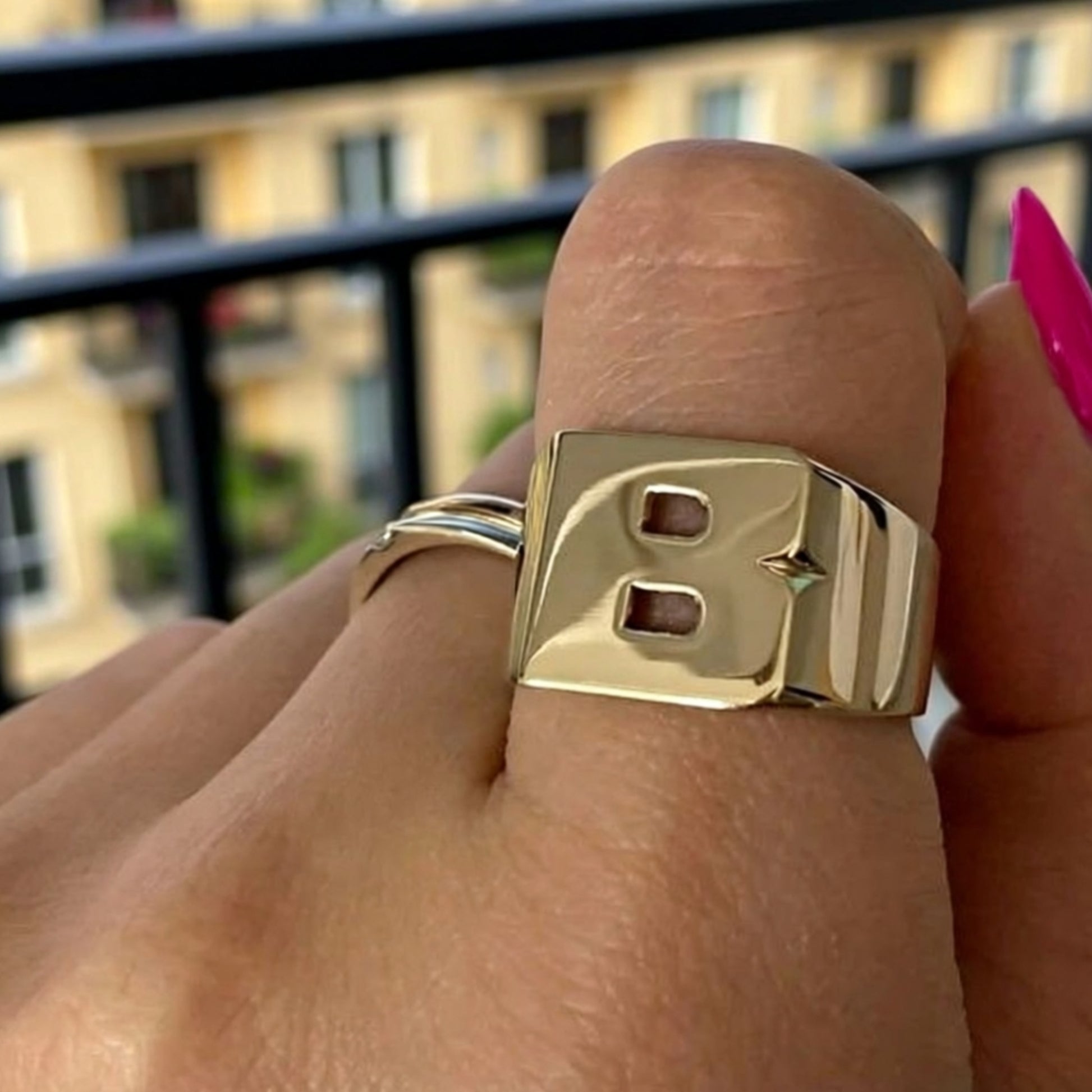 initial ring on a hand