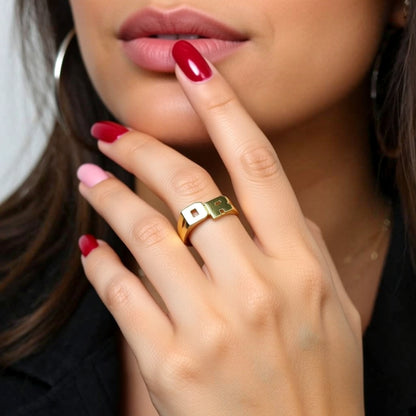 initial ring on a hand