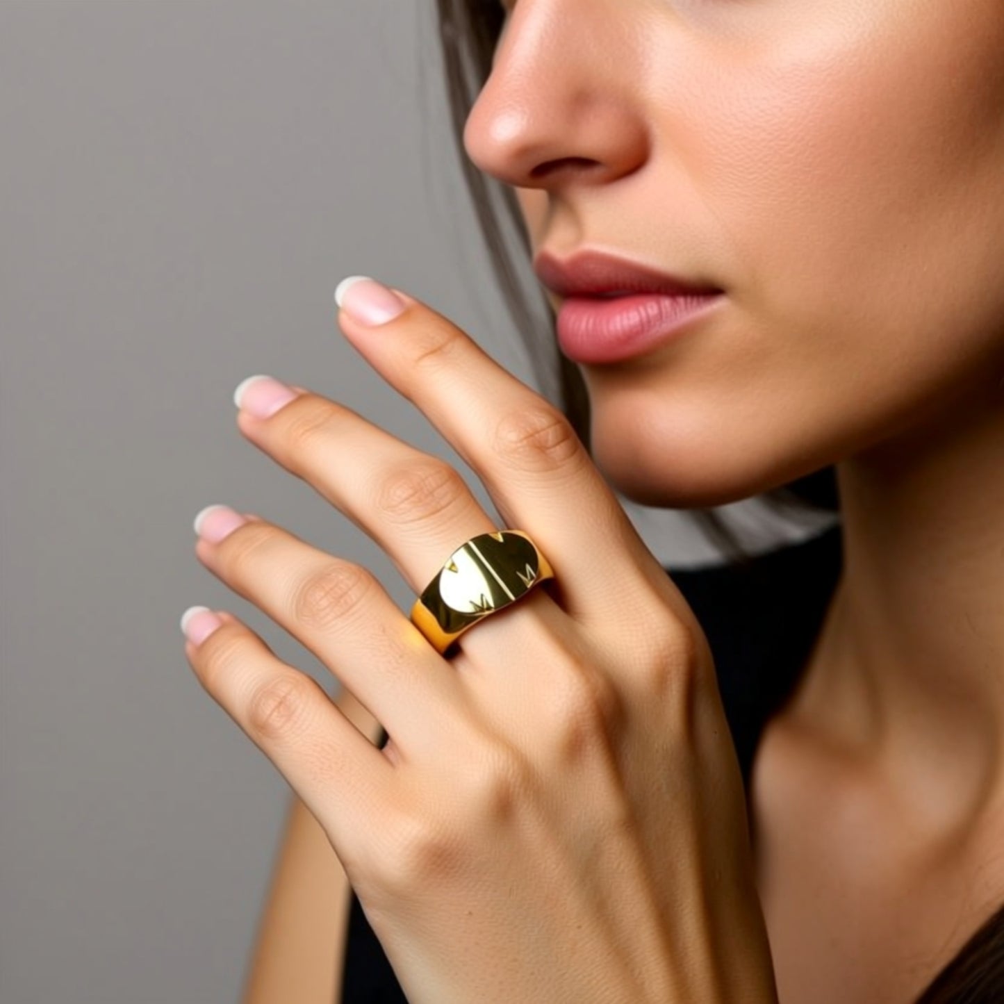 initial ring on a hand
