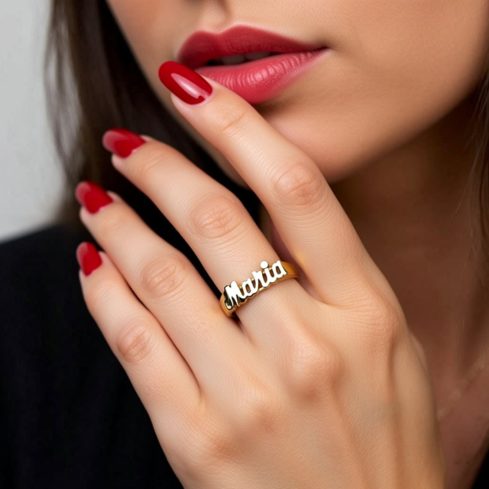 R607 name ring on a hand
