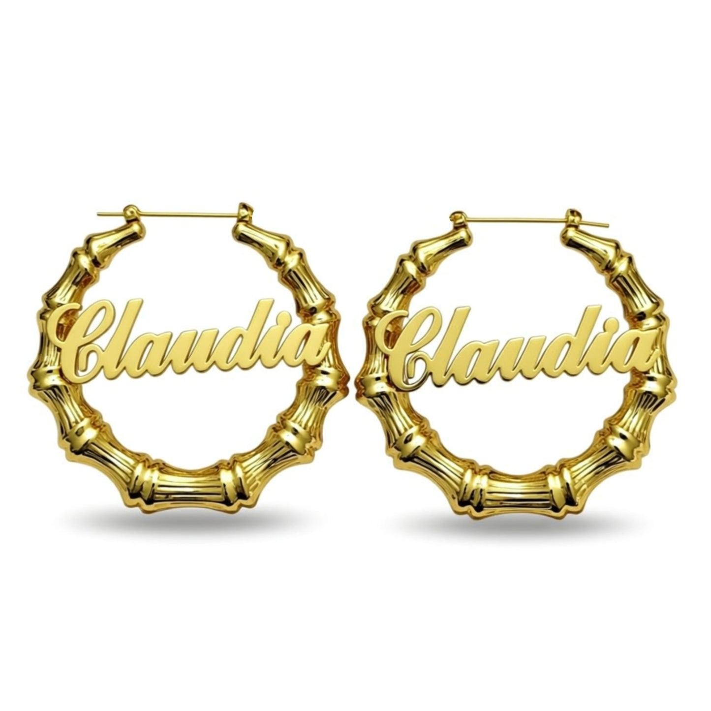 Gold hoop earrings with 'Claudia' inscription on a white background