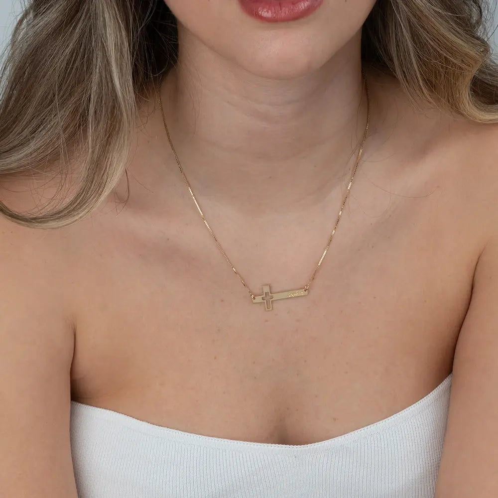 Engraved Cut Out Sideways Cross Necklace on a person