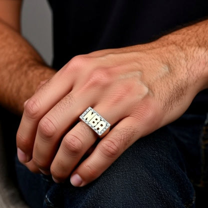 diamond name ring on a hand