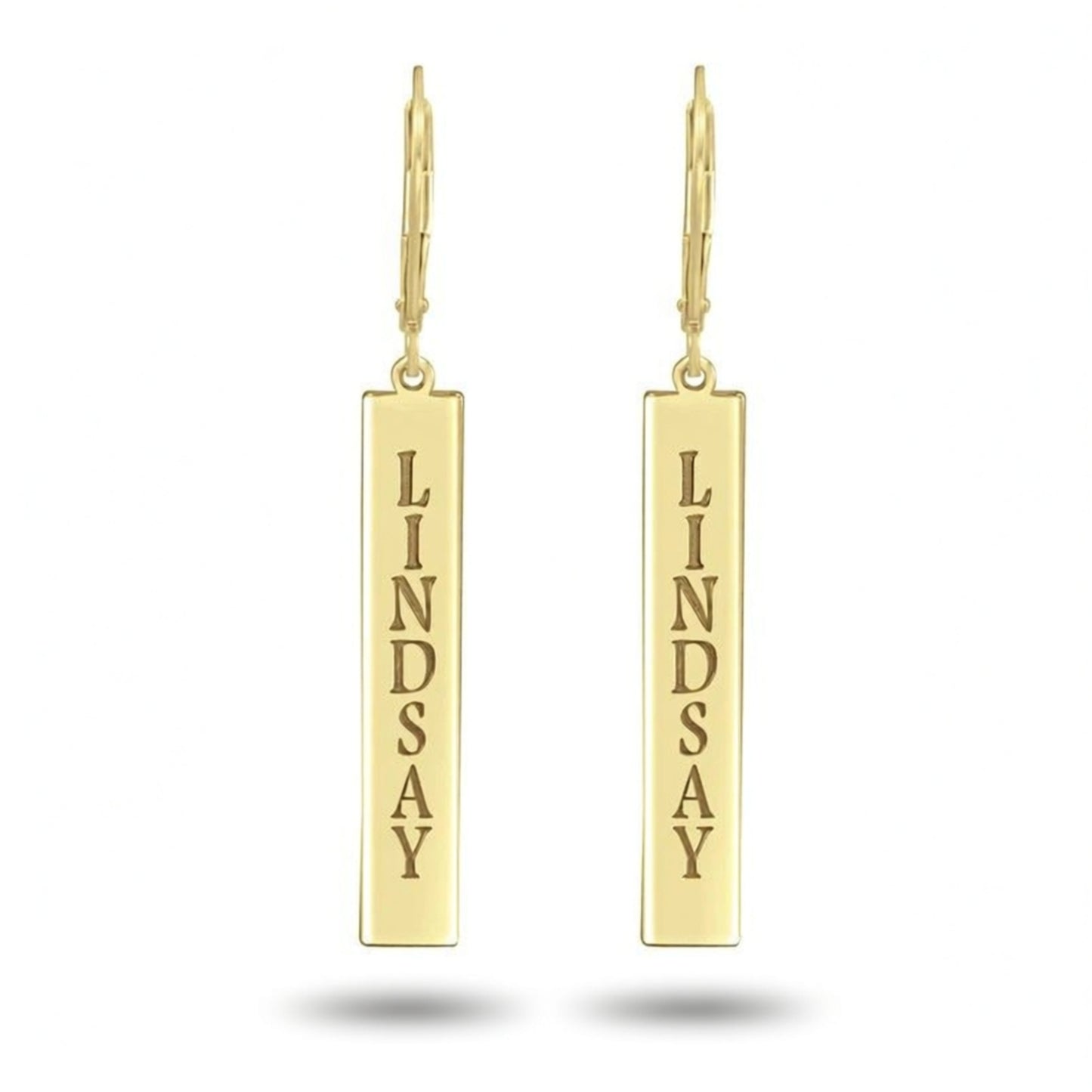 Gold earrings with 'LINDSAY' engraved on a white background