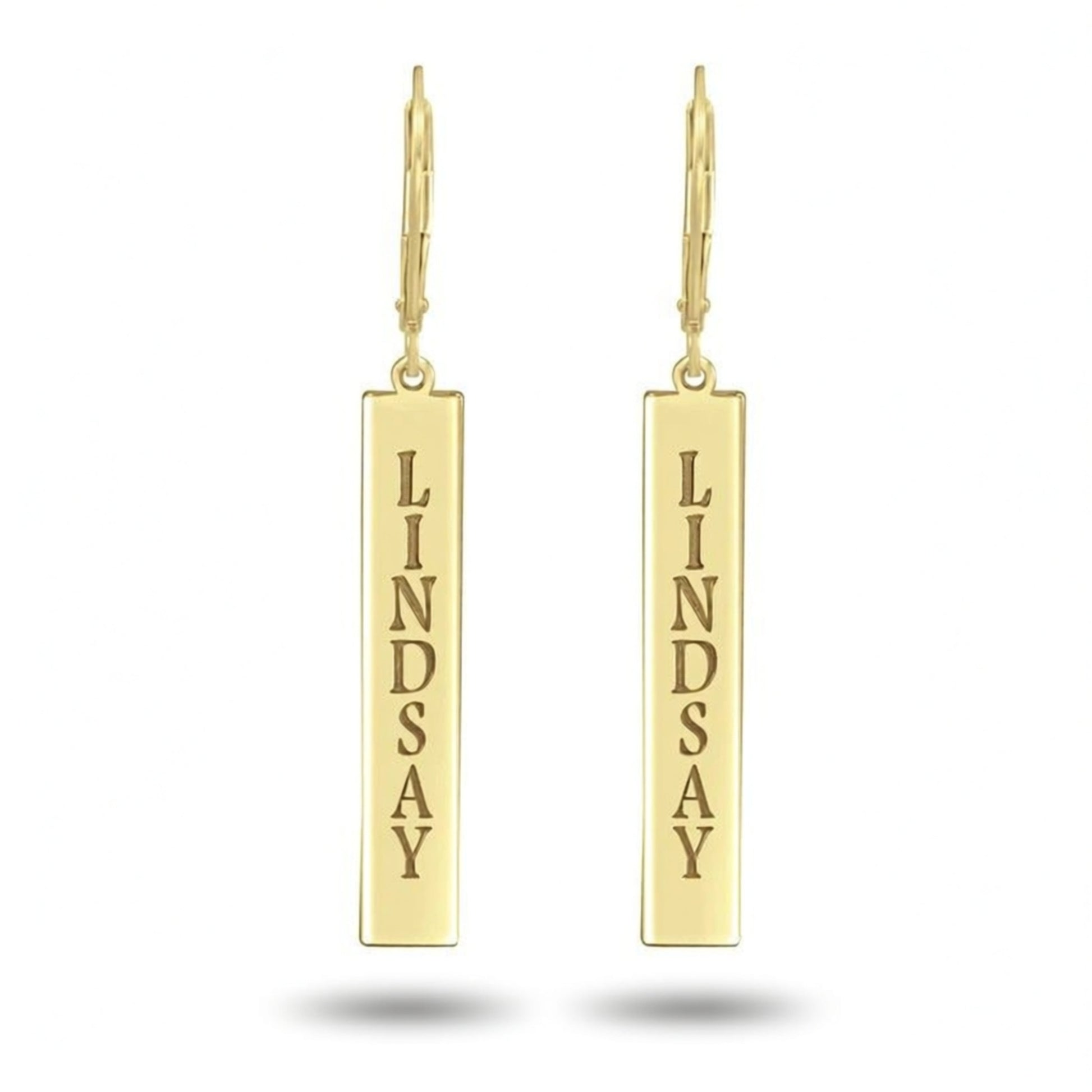 Gold earrings with 'LINDSAY' engraved on a white background