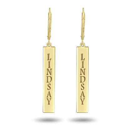 Gold earrings with 'LINDSAY' engraved on a white background