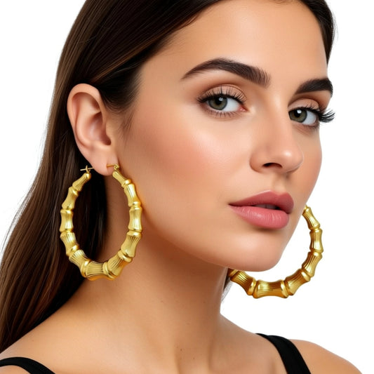 Gold Bamboo Hoop Earrings on a person