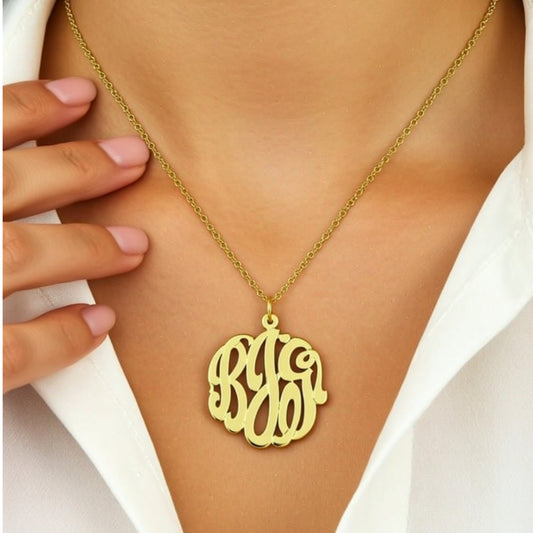 Gold Cutout Monogram Necklace on a    person