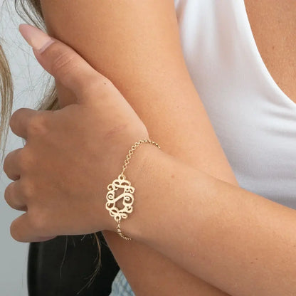 monogram bracelet on a person