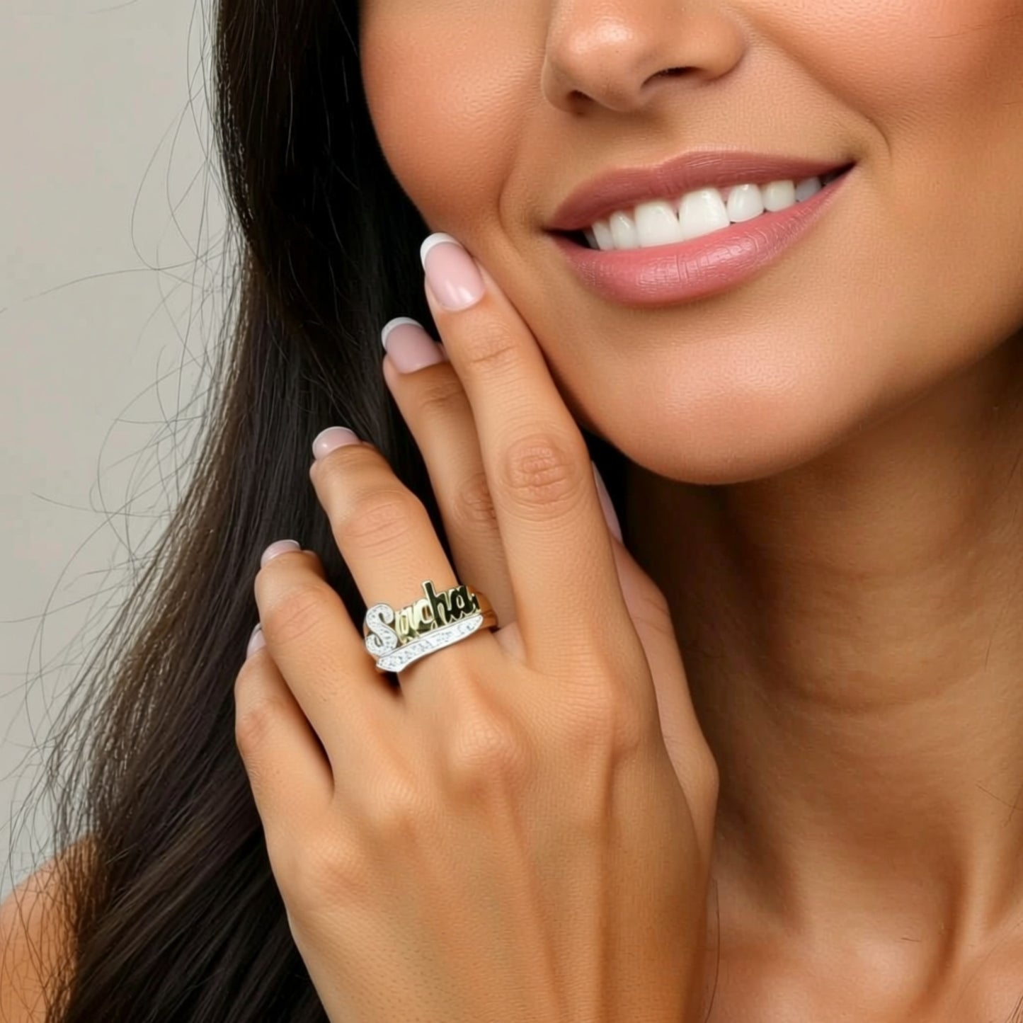 diamond name ring on a hand