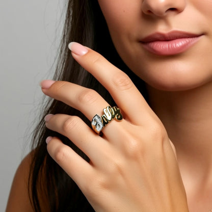 diamond name ring on a hand