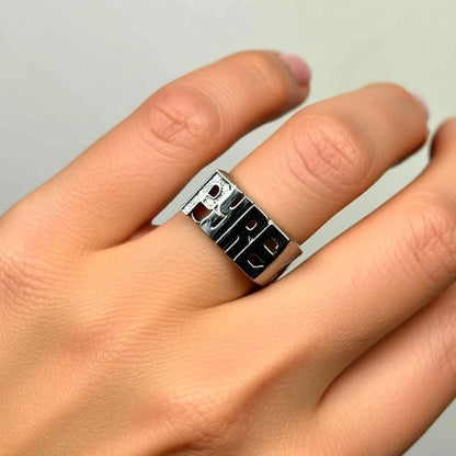 name ring with diamonds on a hand
