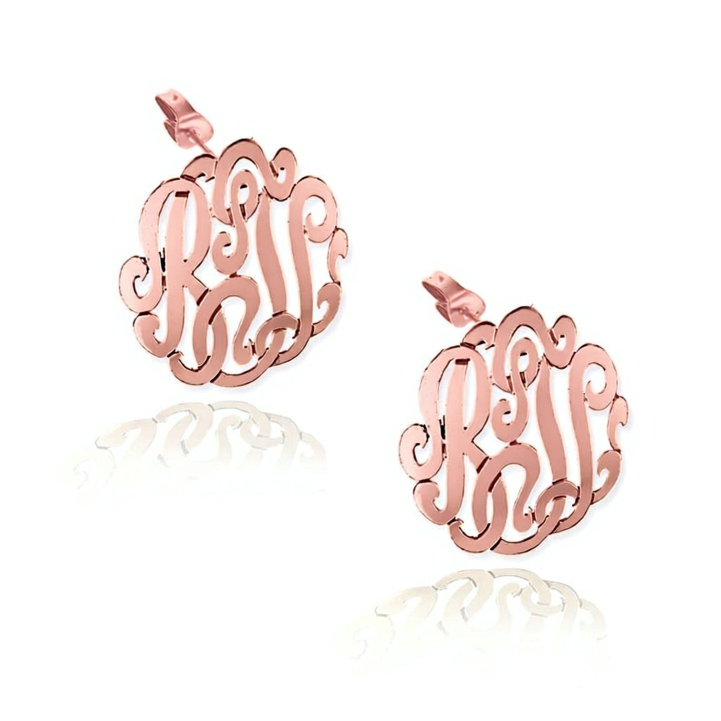 Rose gold monogram earrings on a white background