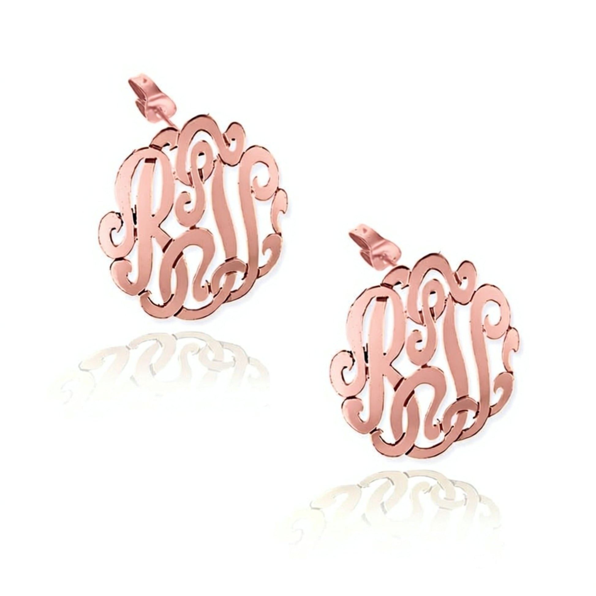 Rose gold monogram earrings on a white background