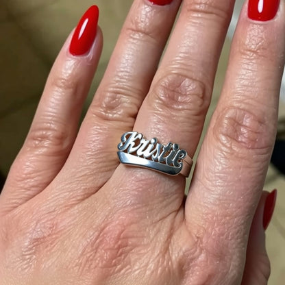 name ring on a hand
