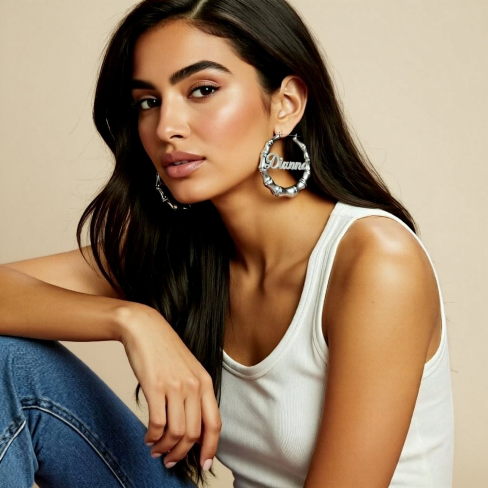 Silver Bamboo Name Hoop Earrings on a person