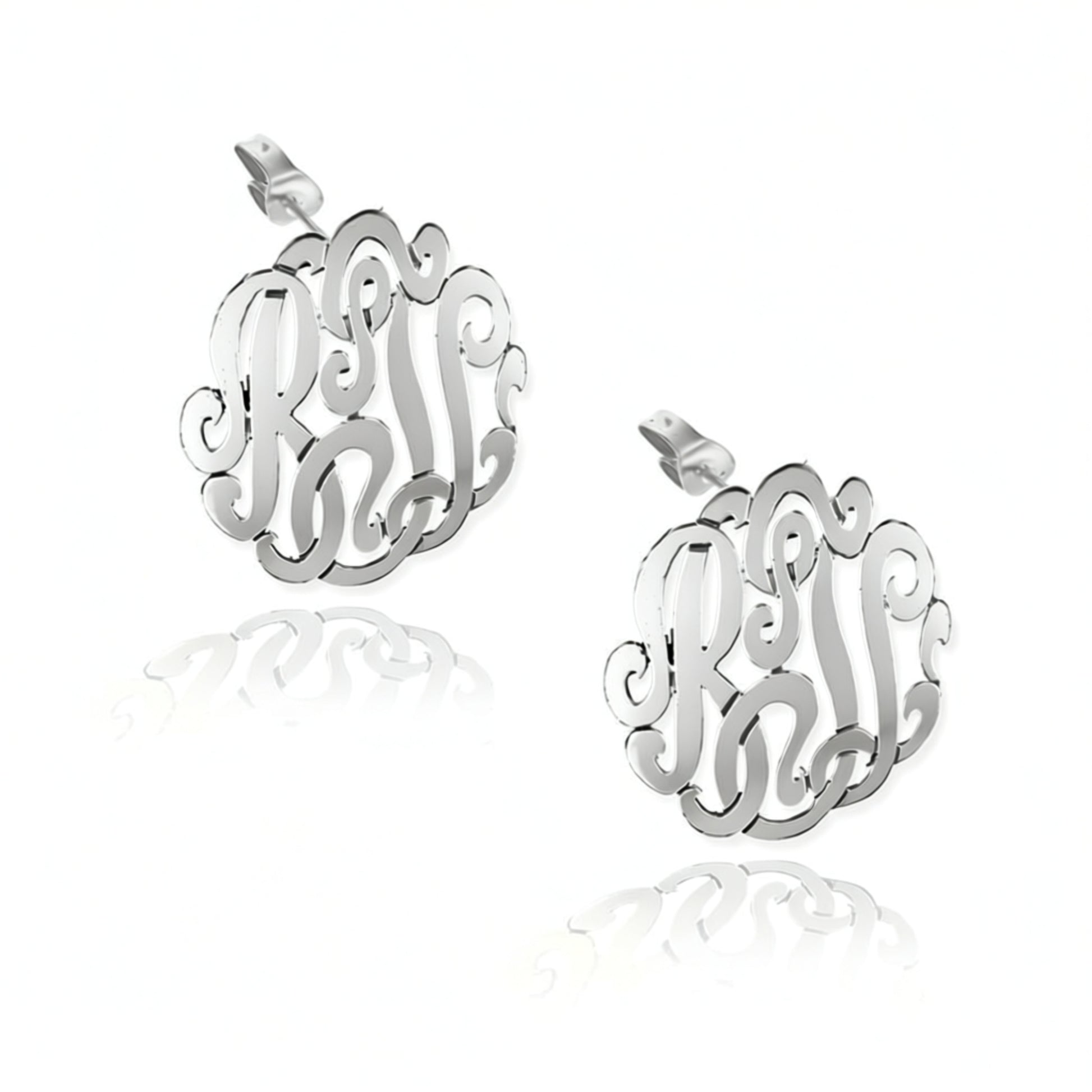 Silver monogram earrings on a white background
