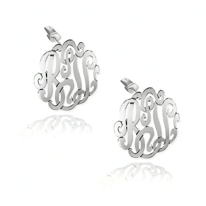 Silver monogram earrings on a white background
