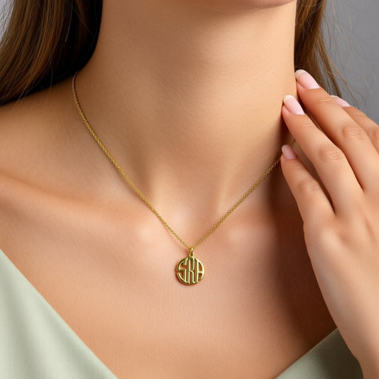 tiny block monogram necklace on a person