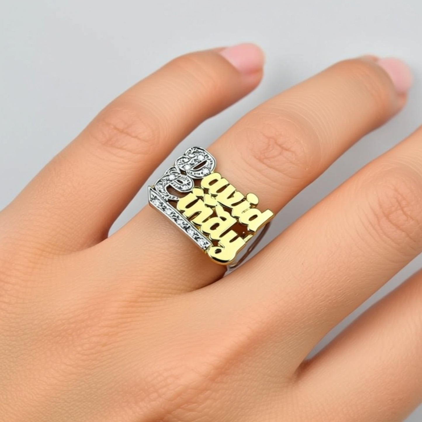 2 name diamond ring on a persons had