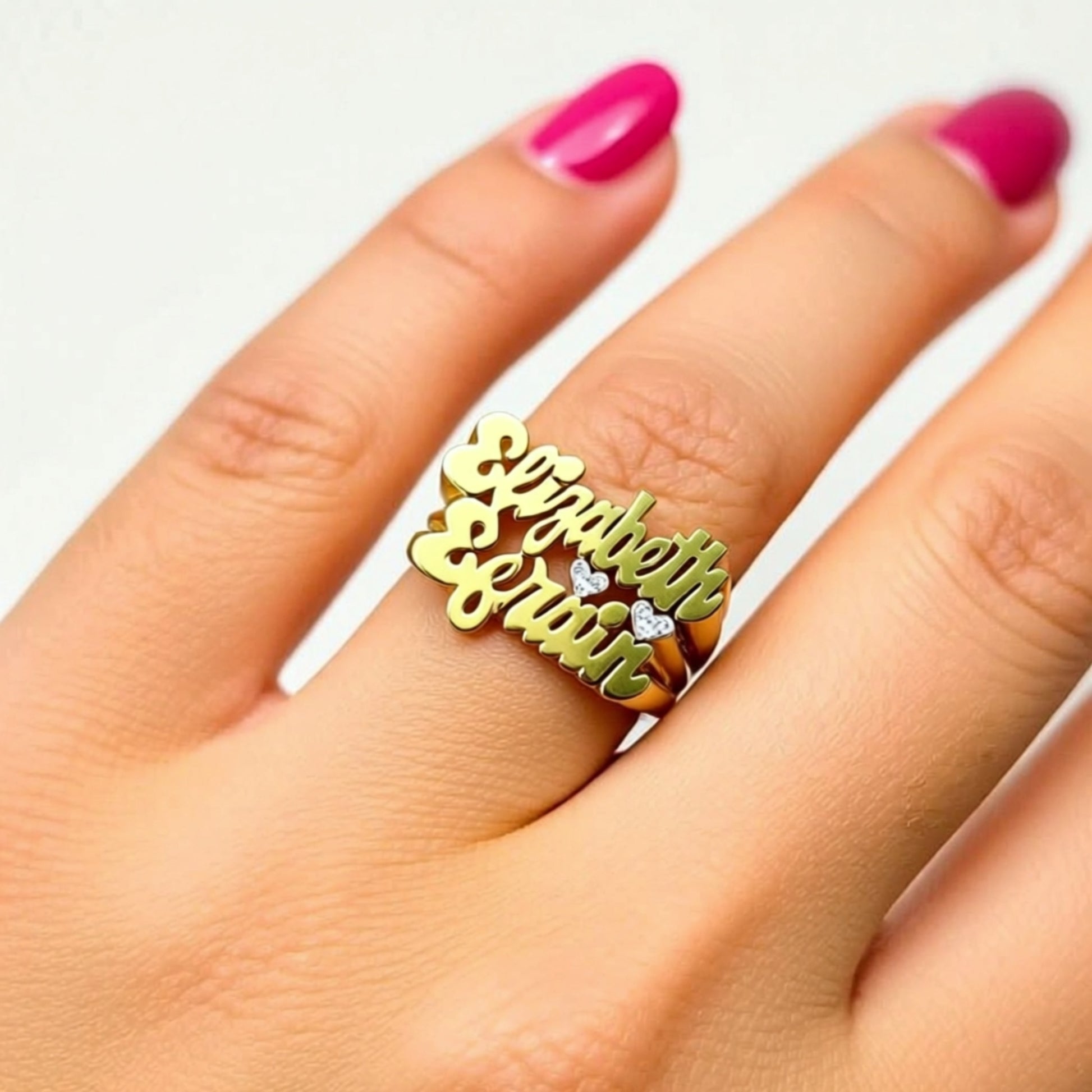 two name ring with hearts and diamonds on a person