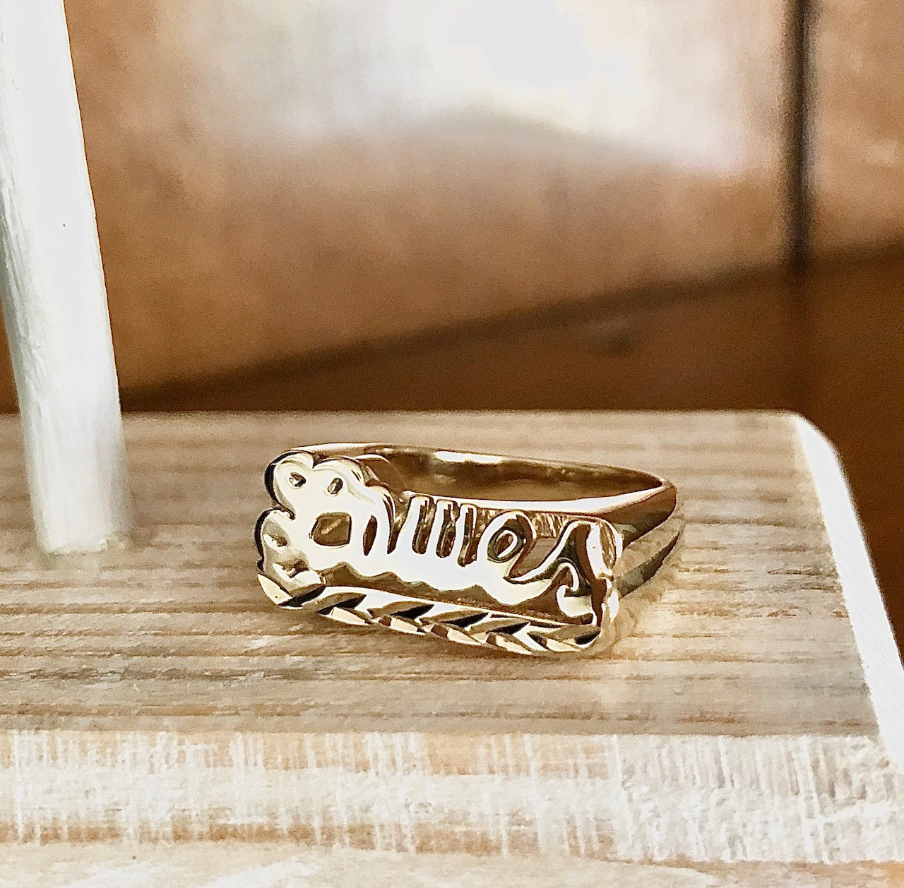 gold name ring with tail